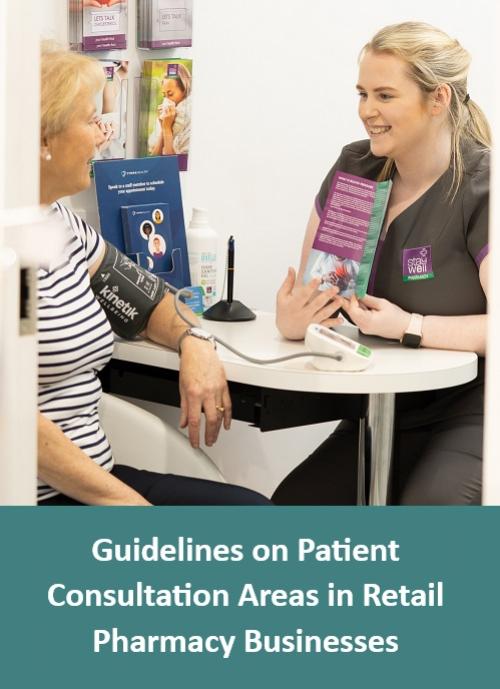 Member of pharmacy team and patient in a consultation room