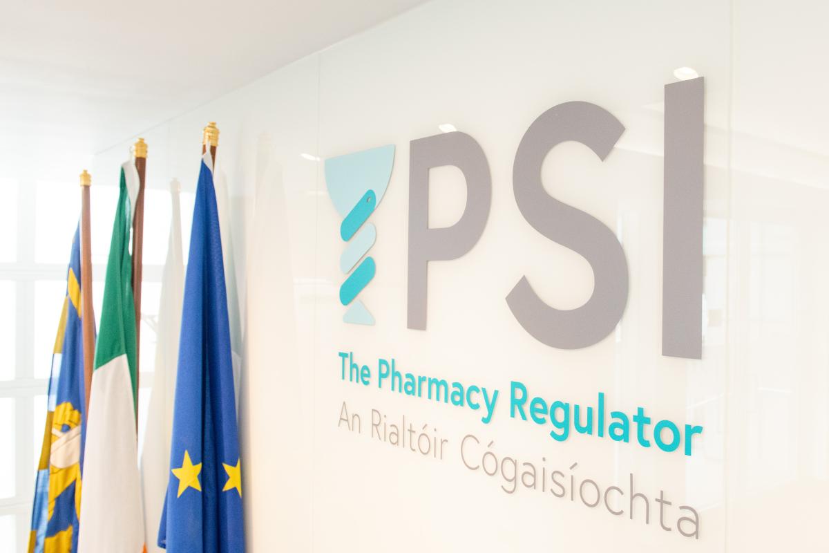 PSI House reception wall with PSI-The Pharmacy Regulator logo