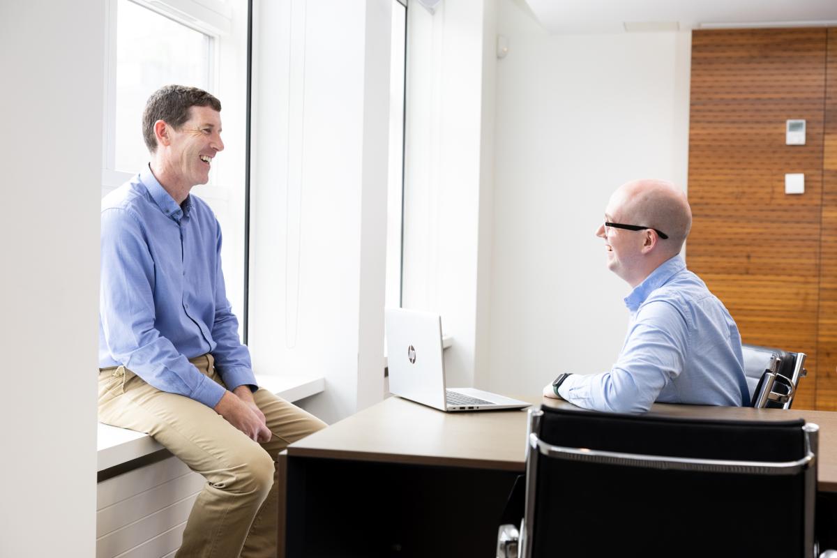 Two members of the PSI sitting in an office